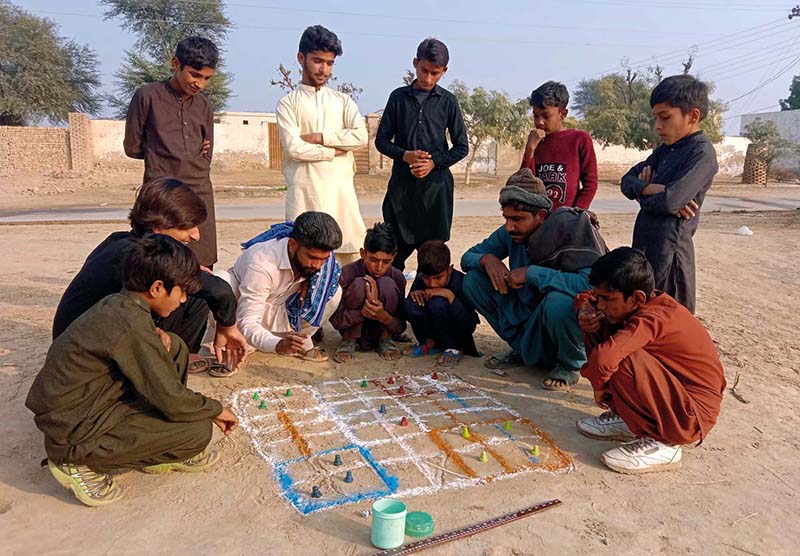 As the afternoon sun softens over the villages, time seems to slow down. Beneath the shade of trees and inside quiet deras, laughter replaces routine and conversation replaces haste. In these unhurried hours — whether under the soft winter sun or in the shade of dense trees during summer a centuries-old traditional game, Chari, is finding its way back into daily life, reconnecting generations in Pakistan’s Bahawalpur region and proving that heritage still has a place in the modern age. (Match the picture with the story Titled ‘Centuries-old game Chari revives community life in Bahawalpur, Multan regions’’ already released by APP)