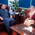 Federal Minister for Maritime Affairs Muhammad Junaid Anwar Chaudhry talking to Minister of State for Education and Professional Training, Wajiha Qamar