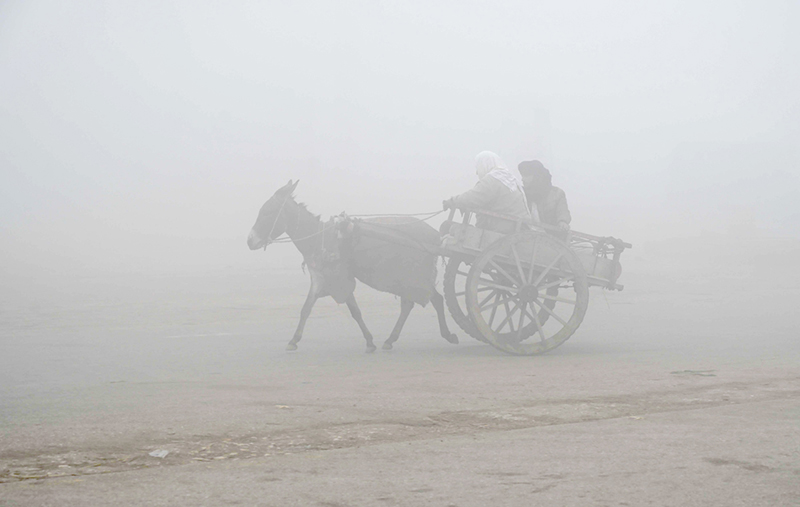 A view of thick fog that engulfs the whole city during morning time