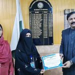 Principal of Government Arts and Commerce College, Prof. Rizwan Gul, presents certificates of appreciation to the winning students of an essay writing competition held to mark the 75th anniversary of Pakistan–China relations