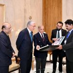 Prime Minister Muhammad Shehbaz Sharif presents a photo album to President of the Republic of Kazakhstan, Kassym-Jomart Tokayev, in the presence of President Asif Ali Zardari, at Aiwan-e-Sadr